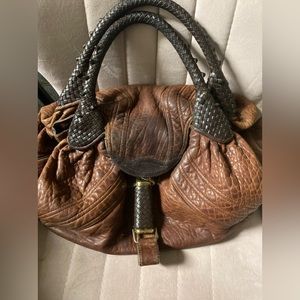 Fendi leather spy bag with braided handles  broken lipstick cover available.